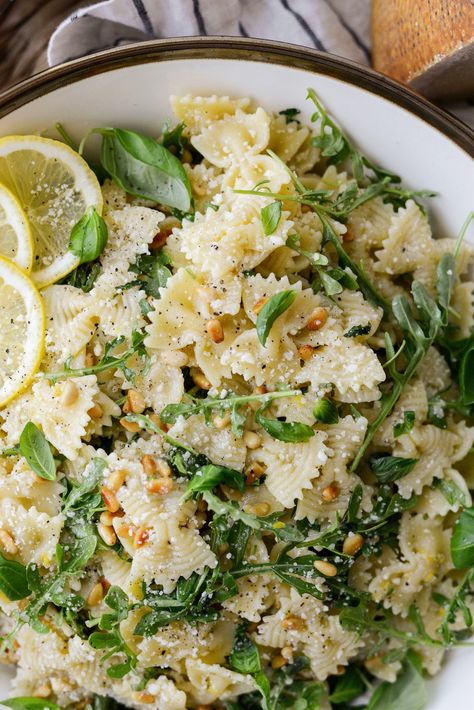 Lemon Basil Parmesan Pasta Salad has cooked pasta, arugula, fresh basil, parmesan and toasted pine nuts tossed in a lemony vinaigrette. Basil Parmesan Pasta, Lemon Basil Pasta Salad, Parmesan Pasta Salad, Lemon Basil Pasta, Basil Pasta Salad, Pasta Salad Ingredients, Basil Pasta, Parmesan Pasta, Lemon Basil