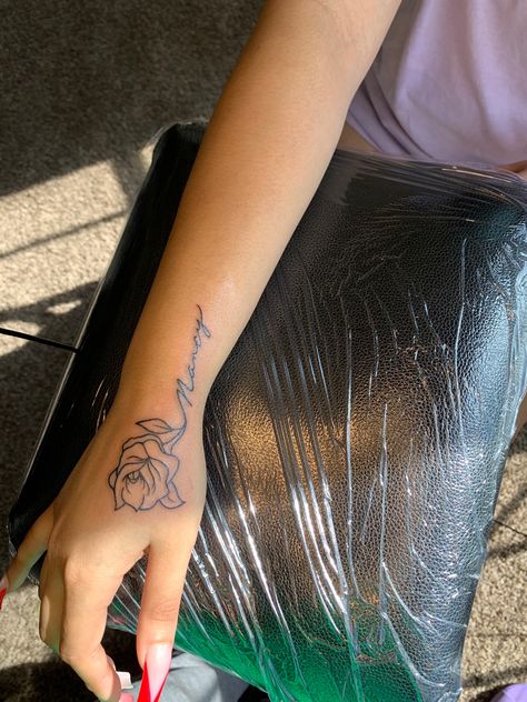 Rose With Name Tattoo, Name Tattoo On Hand, Rose Tattoo With Name, Hand Tattoo Designs, Name Tattoos For Moms, Rose Tattoos For Women, Cute Hand Tattoos, Saved Tattoo, Mom Tattoo Designs