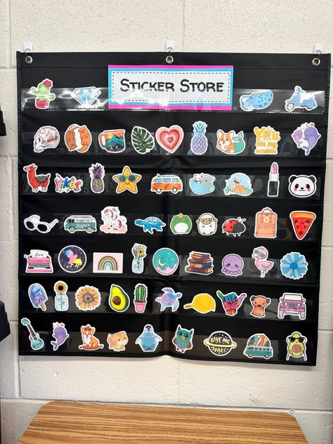 Pocket chart with prize stickers. Incentives For Elementary Students, 3rd Grade Incentives, Sticker Store Classroom Middle School, Sticker Shop Classroom, Sticker Rewards Classroom, Elementary Prize Box Ideas, Classroom Candy Jar Ideas, Classroom Incentives Kindergarten, Class Sticker Store