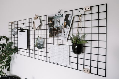 Make your own DIY Metal Wall Grid to help organize your office and home! This nordic inspired black wire organizer is a gorgeous statement piece! Love the idea of styling this piece with plants, home ideas, and pictures to make a beautiful vision board! #desk #office #dorm #bedroom #inspiration Office Grid Wall, Grid Board Ideas, Grid Board, Diy Wall Grid, Aesthetic Wall Grid Ideas, Grid For Desk, Metal Grid Wall Decor, Grid Wall, Steel Grid Wall Decor