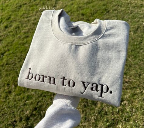 Elevate your wardrobe with our "born to yap" Embroidered Sweatshirt, the perfect blend of style and humor! This cozy sweatshirt features high-quality embroidery that adds a touch of flair to your everyday look. Our sweatshirt makes a great gift for her, whether you're shopping for a friend, or yourself. It's a fun shirt that's perfect for any occasion. Treat yourself or surprise a friend with this unique piece. It also makes a thoughtful gift for birthdays, holidays, or any special occasion. HOW Cute Thoughtful Gifts For Best Friend, 22 Year Old Christmas Gifts, Born To Yap, Circuit Sweatshirt Ideas, Cricket Sweatshirt Ideas, Gifts For 30 Year Old Women, Cute Embroidered Sweatshirt Gift, How To Style A Crew Neck Sweatshirt, Born To Yap Hoodie