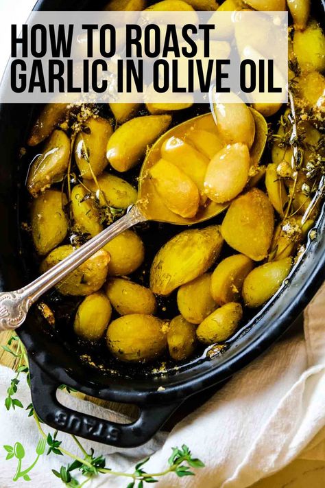 This easy Garlic Confit recipe is a wonderful way to add flavor to your meals. And it's as easy as roasting the garlic in olive oil in the oven. Garlic Oil Recipe, Preserving Garlic, How To Cook Garlic, Garlic In Olive Oil, Baked Olives, Roasted Garlic Recipe, Confit Recipes, Roasting Garlic In Oven, Roasted Olives