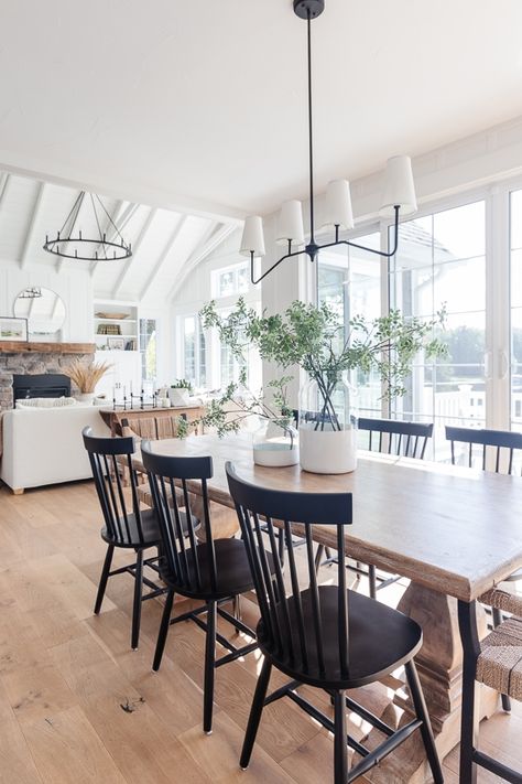 wood table with black chairs and white vases Black Kitchen Chairs, Coastal Dining Room, Black Chairs, Coastal Dining, Farmhouse Chairs, Kitchen Table Wood, Farmhouse Kitchen Tables, Black Dining Chairs, Black Dining Room