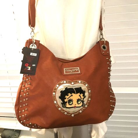 Great Buy On These Well Made, Faux Leather Betty Boop Purses, We Cannot Get More, Left From Our Closed Business, Purse Is So Strong, Weighs A Few Pounds, Great Straps And Compartments, Brown Color This Purse Is Large And Heavy, Probably Weighs Over 2 Pounds Empty. Has A Cross Body Strap And Handles Note: There Is A Matching Wallet Sold Separately - $35 But No Additional Shipping If You Do A Bundle. This Listing Is Just For The Purse Betty Boop Backpack, Brown Faux Leather Shoulder Bag With Snap Closure, Brown Faux Leather Bag With Snap Closure, Thrifting Moodboard, Business Purse, 2000s Bags, Betty Boop Handbags, Betty Boop Purses, Leather Tote Handbags