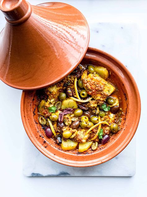 Fish Tagine with Chermoula Sauce - Feast with Safiya Fish Tagine Moroccan, Moroccan Fish Tajine, Tagine Photography, Fish Tagine Recipes, Moroccan Lunch, Moroccan Fish Recipe, Moroccan Tagine Recipes, Moroccan Tajine, Fish Tagine