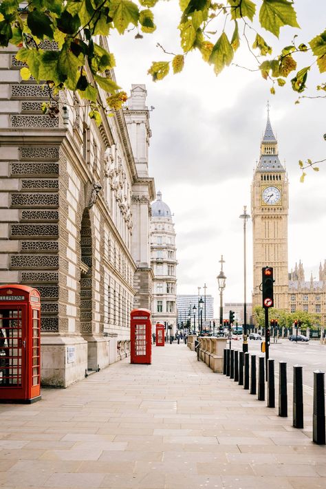 Red phone booths used to be all over the city, but these days there are less and less – and further between them. The best way to catch a lot of these distinctive little boxes in one shot (with a great backdrop too) is on Great George Street in Westminster. There's a booth every few steps with a view of Big Ben in the background.   [i]Great George Street, Westminster, London SW1P 3AD[/i] London Wallpaper, Big Ben Clock, Westminster London, Big Ben London, London Aesthetic, Chrysler Building, City Of London, London Places, Voyage Europe