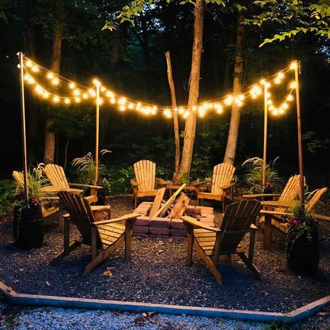 12 Outdoor Fire Pit Lighting Ideas | The Family Handyman Fire Pit Lighting Ideas, Outdoor Fire Pit Area, Bonfire Pits, Cedar Posts, Fire Pit Lighting, Diy String Lights, Fire Pit Landscaping, Patio Fire Pit, Fire Pit Area