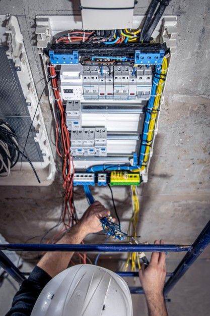 A male electrician works in a switchboar... | Free Photo #Freepik #freephoto #house #man #construction #work Electrician Social Media Post, Electrician Wallpaper, Electrition Aesthetic, Electrician Aesthetic, Electricity Aesthetic, Electric Wallpaper, Electrical Estimating, Exposed Wiring, Electric Man