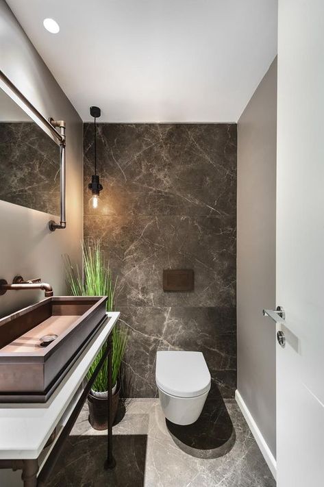 a chic guest toilet with stone tiles, a large metal sink, a fake potted plant and some pipes for an industrial feel Toilet Design Modern, Small Toilet Design, Toilette Design, Toilet Room Decor, Wc Design, Small Toilet Room, Toilet Sink, Guest Toilet, Contemporary Bathroom Designs