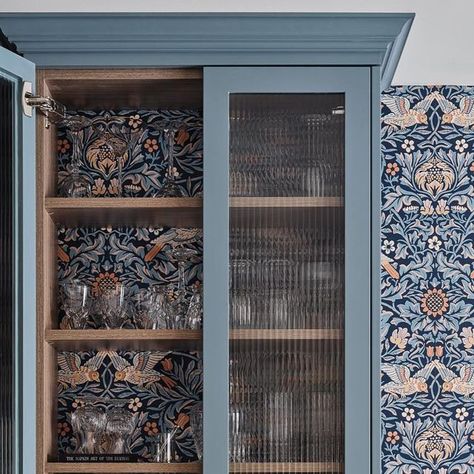 Grassroots Design + Build on Instagram: "Here it is! Oh wallpaper how you make something beautiful even MORE beautiful. This cabinet inlay with wallpaper and wood is perfection! Farrow & Ball Paint Colour: De Nimes #grassrootsdesign #interiordesign #interiordecor #interiordesignandbuild #home #interiors #homedesign #interiordesigner #designinspiration #modernhome #ottawa #ottawadesign #ottawainteriordesigner #interiordesignottawa #homedecor #decor #decoration #interiorstyling #shelfstyling #wallpaper #farrowandballpaint #homestyling #kitchendesignconcepts #customkitchendesign #kitchendesigninspo #modernkitchendesign #kitchendesignideas #kitcheninsporation" Farrow And Ball Trellis Wallpaper, Glass Cabinet Wallpaper, Wallpapered Cabinet Interior, Cabinet With Wallpaper Inside, Wallpaper In Cabinets, Wallpaper On Kitchen Cabinets, Wallpaper Inside Cabinets, De Nimes Farrow Ball, Grassroots Design