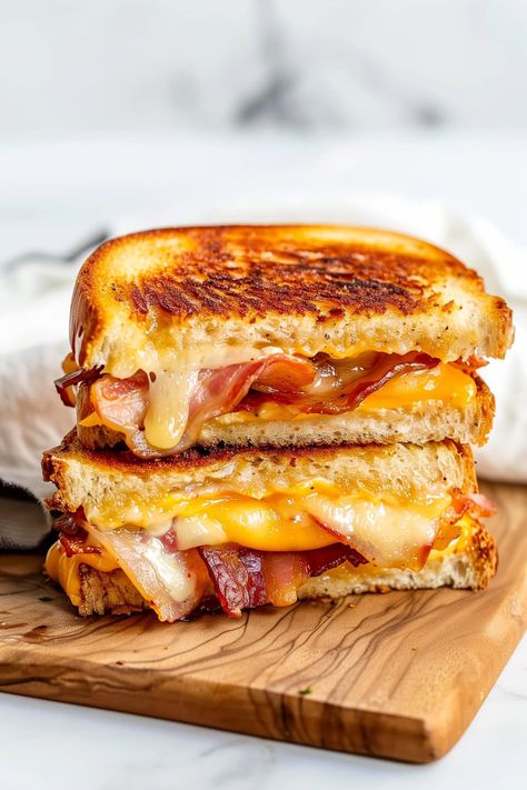 This quick and easy bacon grilled cheese sandwich is crispy on the outside, and epically cheesy on the inside, with salty, smoky bacon in every bite. Bacon Grilled Cheese Sandwich, Bacon Grill, Bacon Grilled Cheese, Best Grilled Cheese, Grilled Cheese Recipes, Chapati, Cheese Sandwich, Grilled Cheese Sandwich, Cheese Sandwiches