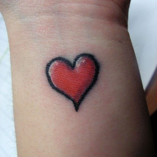 Simple minimalistic black heart tattoo  Heart tattoo wrist Heart tattoo  designs Black heart tattoos