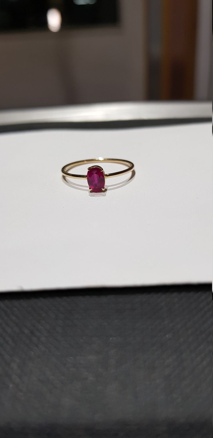 14k solid yellow gold 6x4 mm natural ruby precious gemstone ring. 1. The weight of the natural ruby precious gemstone used in the ring =0.56 cts. 2. The weight of the 14k solid yellow gold used in the ring=0.840 gms. The ruby is the birthstone for the people born in the month of July. This is absolutely gorgeous ring. I am pretty confident that my work will be appreciated. Thanks. Fine Jewelry Ruby Ring With Oval Cabochon, Dainty 14k Gold Oval Sapphire Ring, Fine Jewelry 14k Gold Oval Cabochon Ruby Ring, Oval Ruby Birthstone Ring With Prong Setting, Oval Cabochon Ruby Ring In Yellow Gold, Fine Jewelry Yellow Gold Ruby Ring Oval Cabochon, Fine Jewelry Yellow Gold Oval Cabochon Ruby Ring, Yellow Gold Oval Cabochon Ruby Ring, Dainty Oval Ruby Ring With Prong Setting