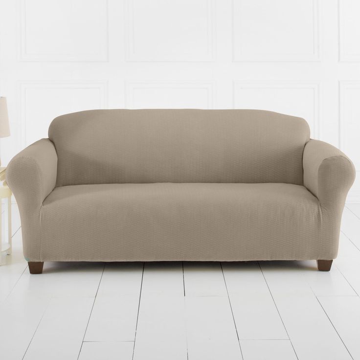 a couch sitting on top of a white floor