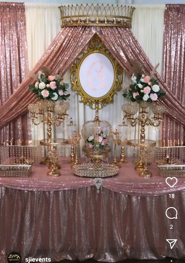 a table topped with lots of gold and pink decorations