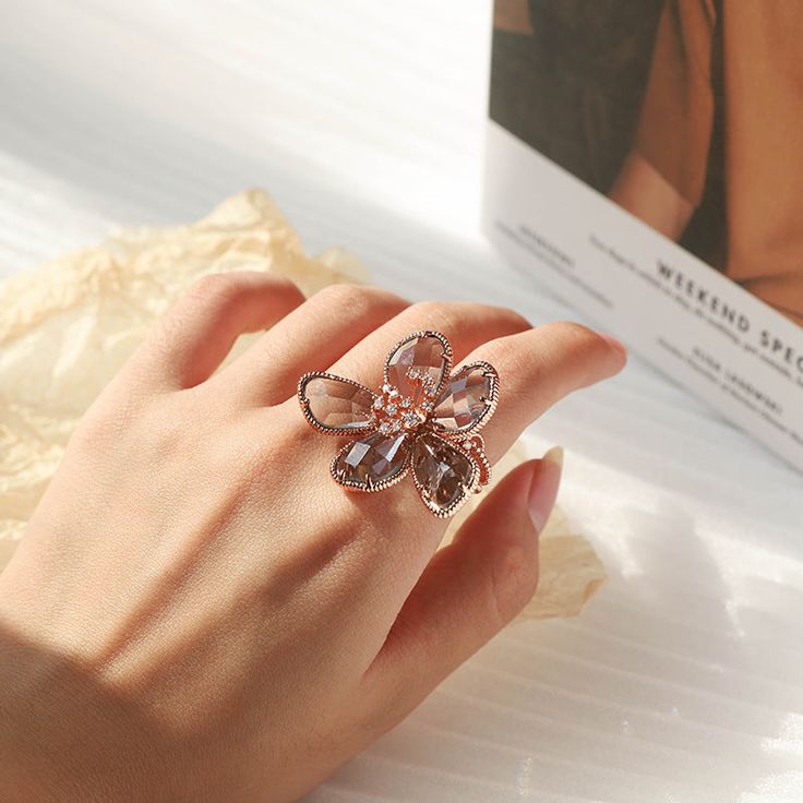 Floral Crystal Ring Rose Gold Metal Rings For Wedding, Rose Gold Flower Ring For Gift, Elegant Handmade Rose Gold Flower Ring, Rose Gold Crystal Flower Jewelry, Rose Gold Crystal Flower-shaped Jewelry, Rose Gold Crystal Jewelry With Flower Shape, Rose Gold Flower Shaped Crystal Wedding Ring, Adjustable Crystal Flower Ring, Rose Gold Open Butterfly Ring For Wedding