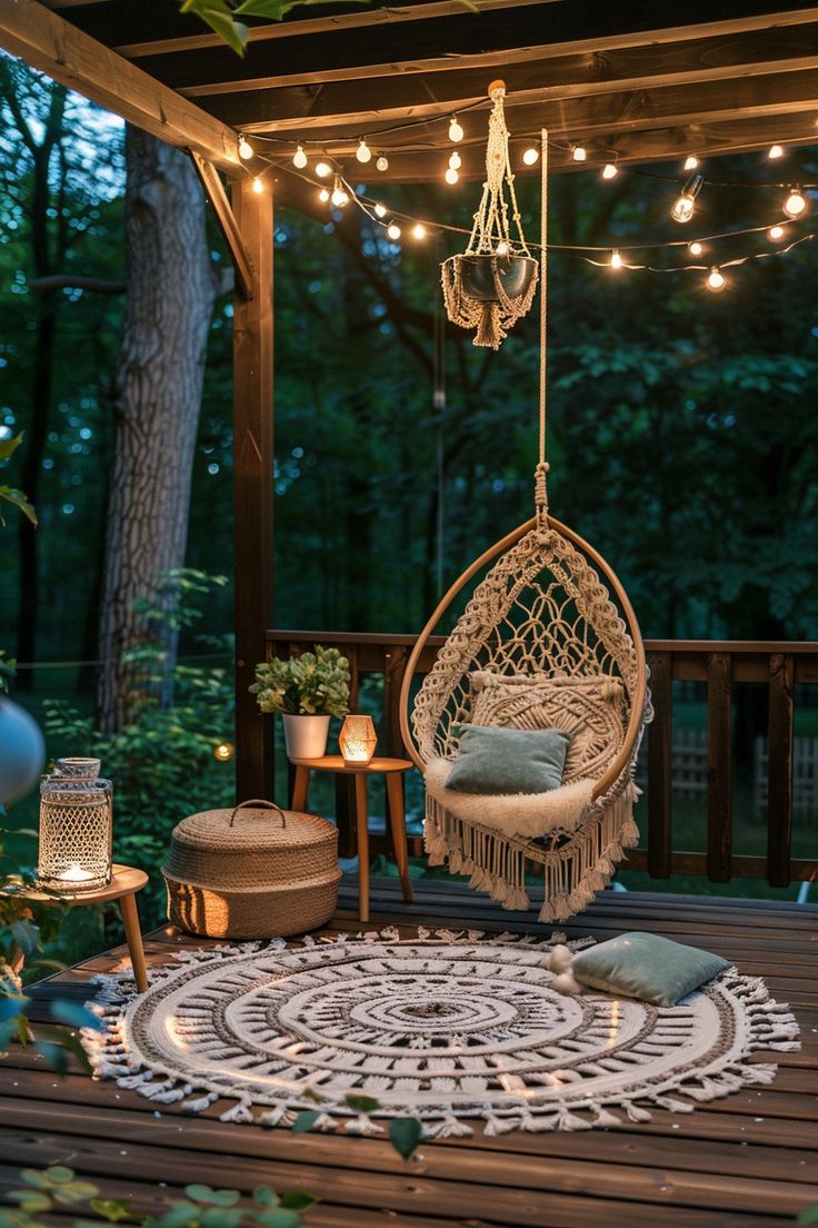 a hammock hanging in the middle of a deck with lights strung over it