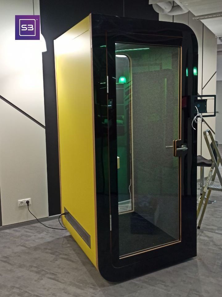 a yellow and black portable shower in a room