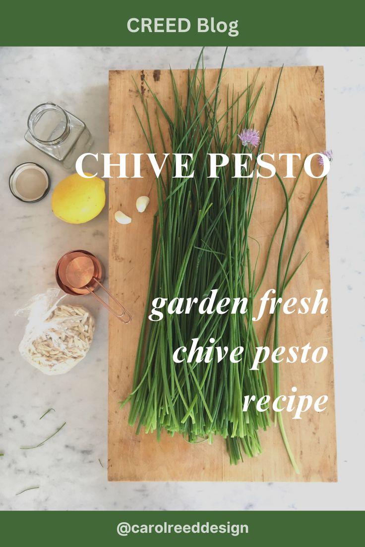 chive pesto on a cutting board with ingredients to make it look like fresh chives