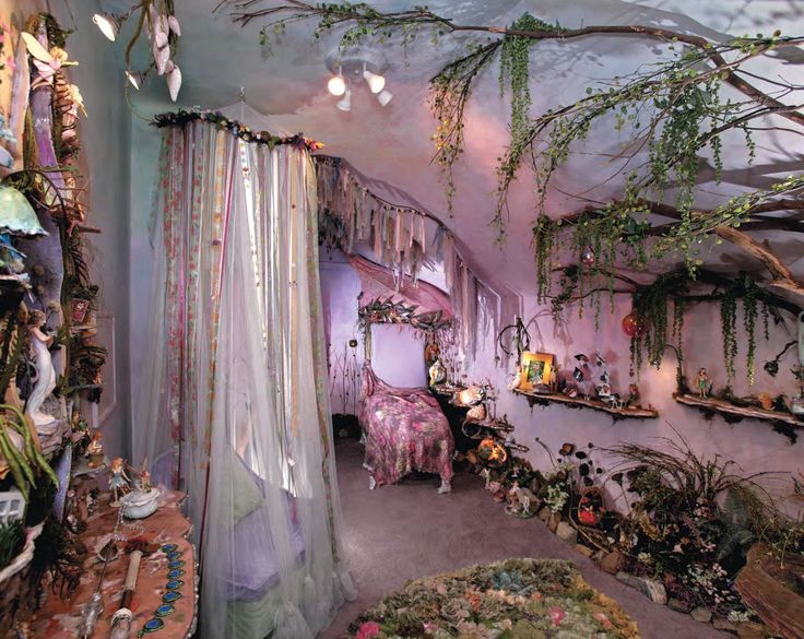 a room filled with lots of hanging plants and decorations on the walls, along with curtains