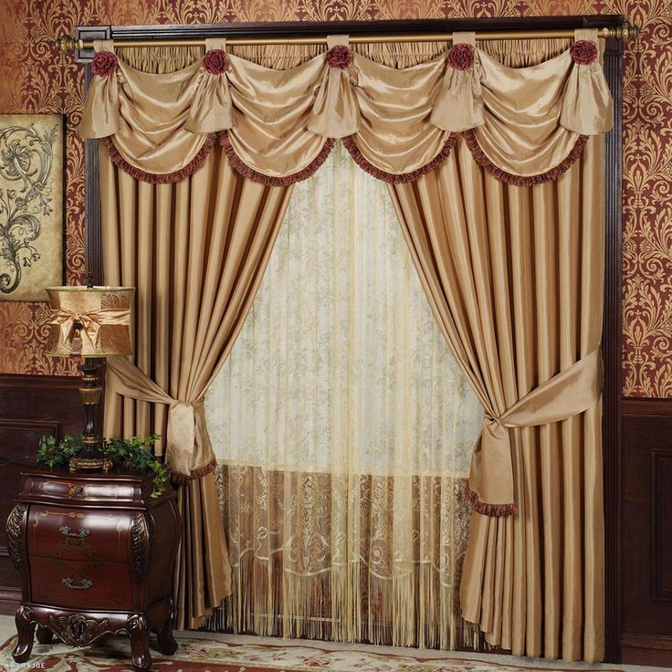 a living room with curtains and a rug in front of the window, along with a chest of drawers