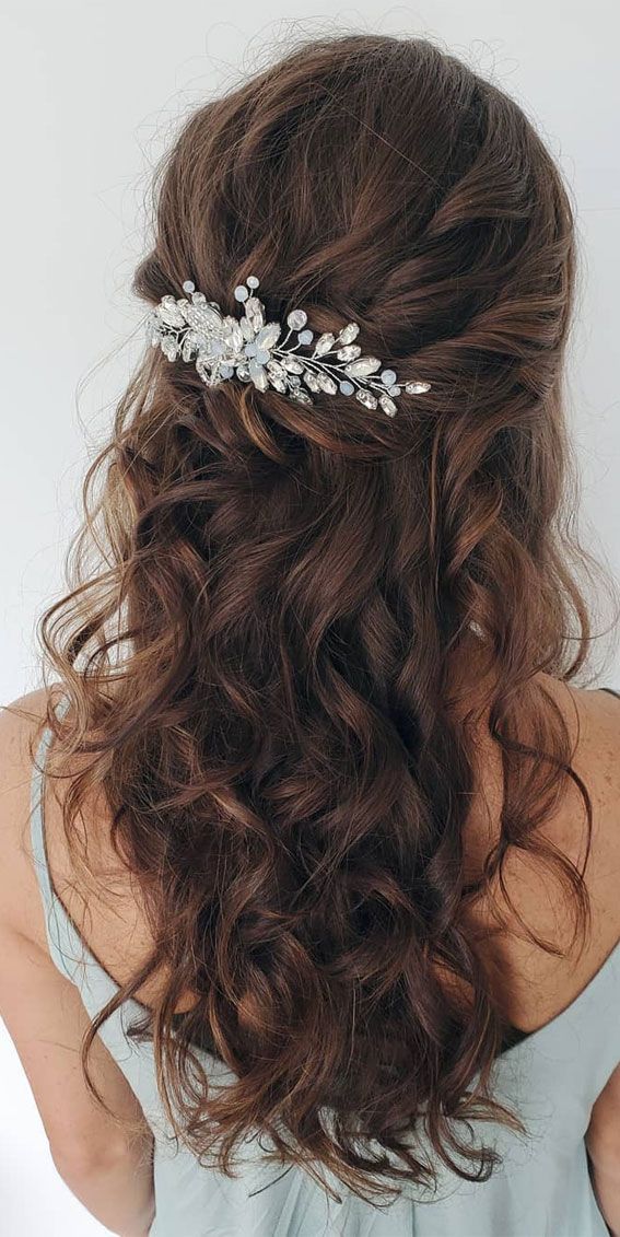 the back of a woman's head wearing a bridal hair comb