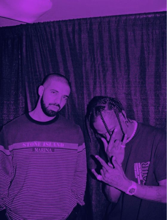 two men standing next to each other in front of a purple curtain with the word stone island written on it