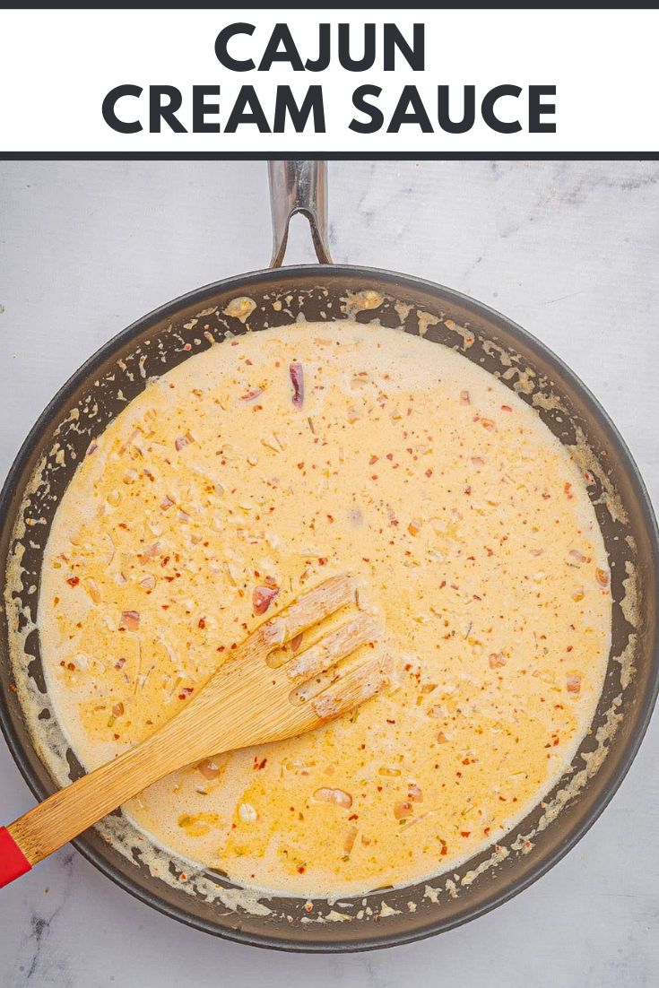 a skillet filled with cream sauce on top of a table