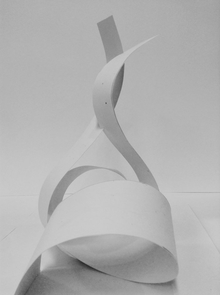 an abstract sculpture made out of white paper