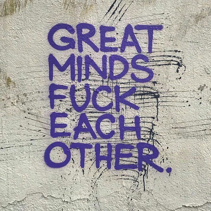 graffiti written on the side of a building reads great minds, f c r each other