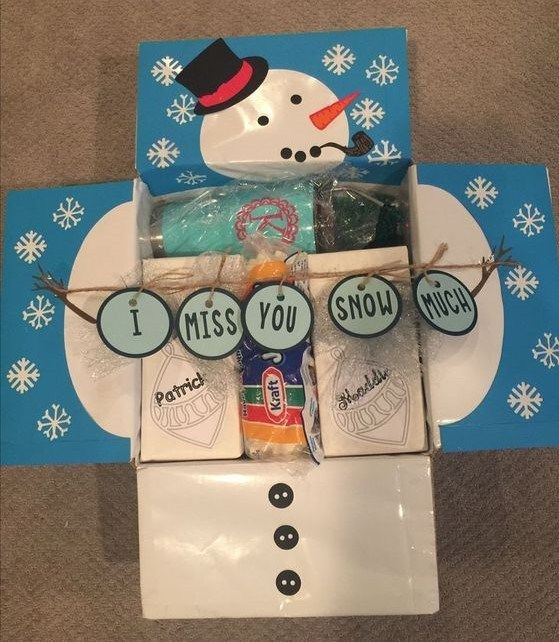 a snowman gift box filled with candy and candies for someone's birthday