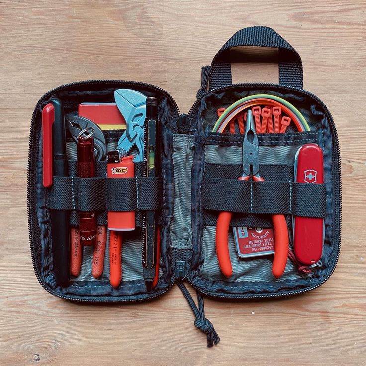 an open tool bag with tools in it