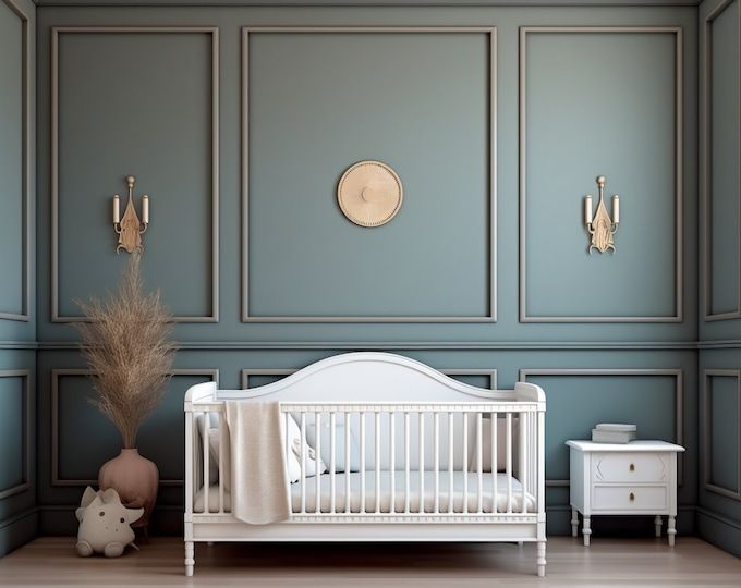 a baby's room with blue walls and white furniture