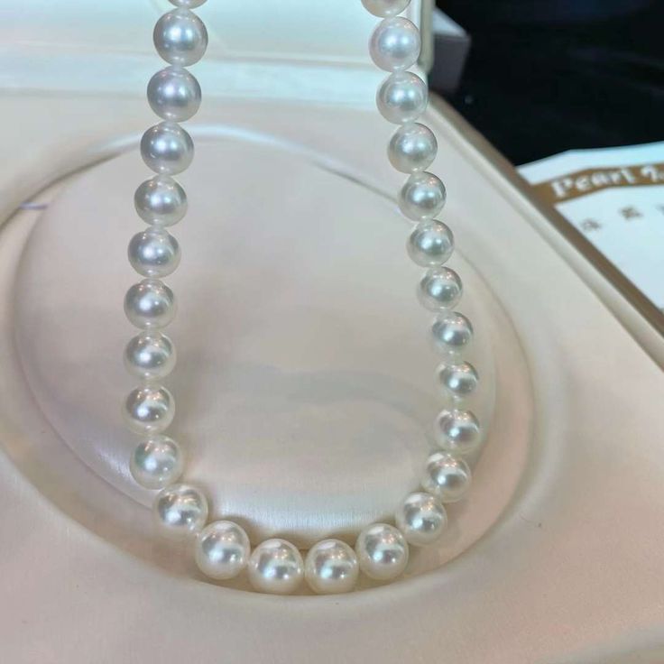 This Japanese Hanadma Grade Akoya Pearl Necklace features 8.5-9mm pearls, with a perfect round shape and strong luster. The nearly flawless quality and elegant aura make it a top choice. With a GGC certificate, these pearls are the best quality, colorless and radiant. Akoya Pearl Necklace, Golden South Sea Pearls, Akoya Pearls, Sea Pearls, South Sea Pearls, Tahitian Pearls, Anklet Jewelry, 50th Gifts, Natural Pearls