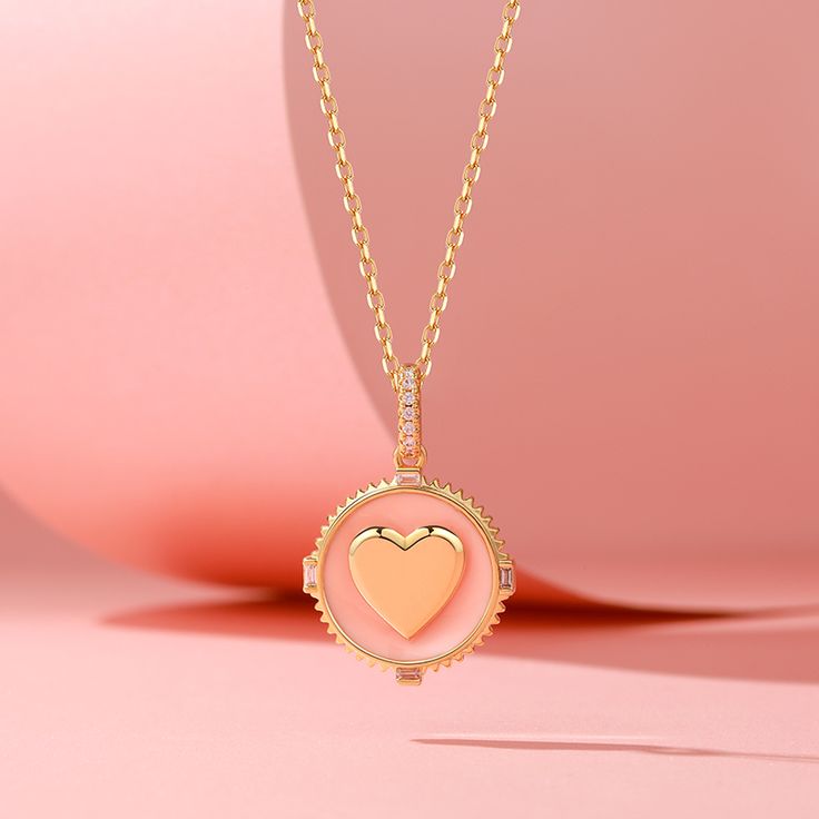 A perfect piece for bringing warmth to your look, the "I Am Loved" necklace will instantly illuminate your day. Made in gold tone sterling silver with pink enamel, set with shimmering rounds and radiant-cut stones, this necklace is designed to help your soul open up and attract passion as the gold heart shines bright around your neck. The engraved words of back will keep you grounded and remind you to love and be loved every time you wear it.Carat Weight: 0.17 ctStone Size: 1.1,2*1 mmStone Type: Pink Gold Plated Necklace For Anniversary, Pink Gold Plated Round Necklace, Pink Gold Jewelry With Clavicle Chain For Gift, Pink Jewelry With Adjustable Chain For Mother's Day, Mother's Day Pink Jewelry With Adjustable Chain, Pink Clavicle Chain Jewelry For Mother's Day, Pink Round Necklace For Valentine's Day, Pink Round Pendant Gold Plated Jewelry, Rose Gold Heart Necklace With Clavicle Chain