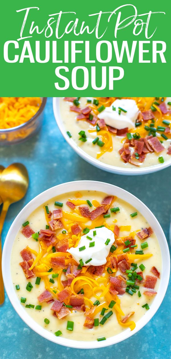 two bowls of instant pot cauliflower soup with sour cream and bacon on top