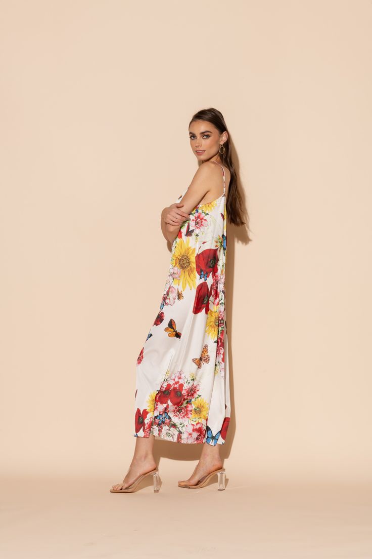 This is one Bouquet you won't want to throw away! Vibrant blooms of flora and fauna adorn this long chemise in our signature Polysilk fabric. Dance the night away, layer it up for brunch, or lounge in luxe - the occasions are endless in this beautiful, blossoming statement piece. Machine washable for ease of care. V-neck Floral Print Nightgown, Maxi Dress