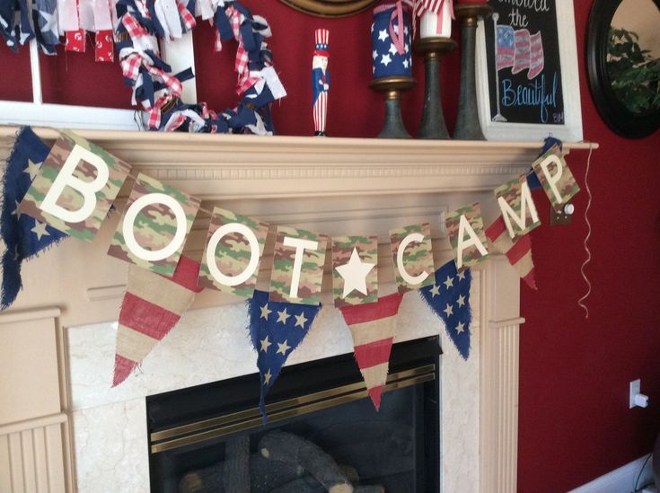 an american flag banner hanging over a fireplace