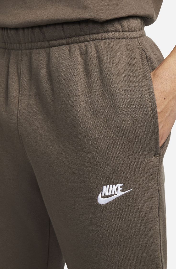 The Nike Sportswear Club Fleece Pants combine classic style with the soft comfort of fleece.Fit: this style fits true to size. . Elastic drawcord waistband . Pull-on style. Side seam pockets; back welt pocket. Logo accent. Brushed-back fleece fabric. Elastic cuffs. Approx. 14" rise, 29" inseam. Imported Machine wash Shell/pockets: 80% cotton, 20% polyester  Side pocket: 100% cotton Nike Cotton Sweats With Pockets, Nike Cotton Sweats With Elastic Waistband, Nike Cotton Joggers, Nike Cotton Joggers For Leisure, Comfortable Nike Cotton Joggers, Comfortable Cotton Nike Joggers, Nike Cotton Sweatpants With Comfort Waistband, Nike Cotton Sweats With Comfort Waistband, Nike Cotton Sweats For Loungewear