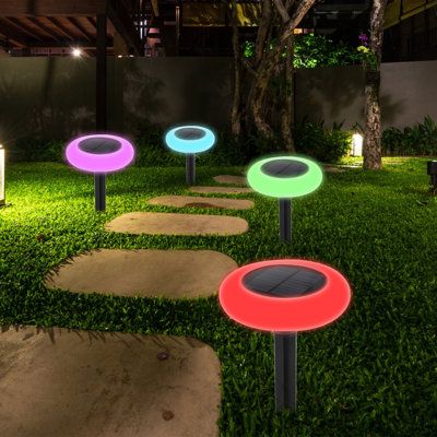 illuminated garden lights in the grass at night