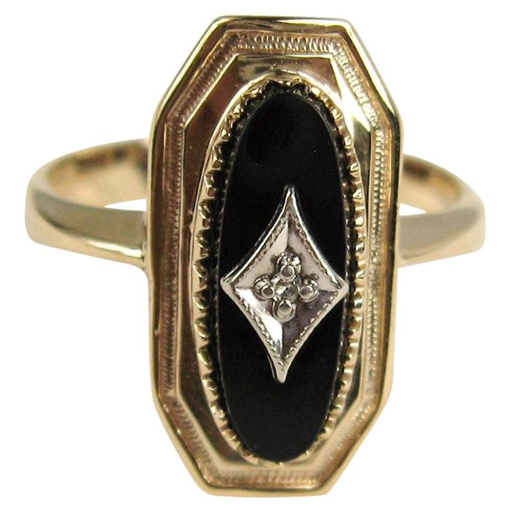 This beautiful ring contains a center oval black onyx that contains a white gold plaque in a diamond shape that contains an old mine cut diamond. The ring is a 10.5 and can be sized by us or your jeweler. Be sure to check our storefront for hundreds of pieces of Fine, costume jewelry, sterling silver, and vintage clothing! Any questions please call, email or hit contact. Thanks! Antique Onyx Ring, Vintage Black Ring, Vintage Onyx Ring, Onyx Rings, Purple Stone Rings, Graduation Rings, Onyx Engagement Ring, Old Mine Cut Diamond, Black Jewel