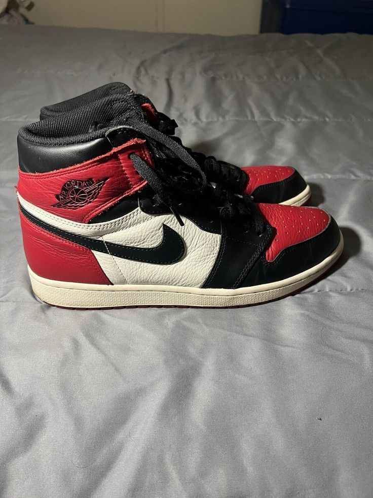 This high-top sneaker is a must-have for any Jordan fan. With a stylish gym red, summit white, and black colorway, this Air Jordan 1 Retro OG Bred Toe is sure to turn heads. The shoe features a high-quality leather upper material and a comfortable athletic style. It's perfect for men who want to add a touch of style to their wardrobe. The sneaker has a 2018 release date and a style code of 555088-610. It's available in size 12.5 and is part of the Air Jordan product line. Don't miss out on this amazing opportunity to own a piece of sneaker history. Athletic Style, Air Jordan 1 Retro, Jordan 1 Retro, Athletic Fashion, Air Jordan 1, High Quality Leather, Release Date, Jordan 1, High Top