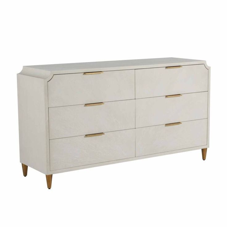 a white dresser with gold handles and drawers on the bottom, against a white background