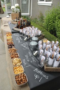 a table topped with lots of different types of food and drinks on top of it