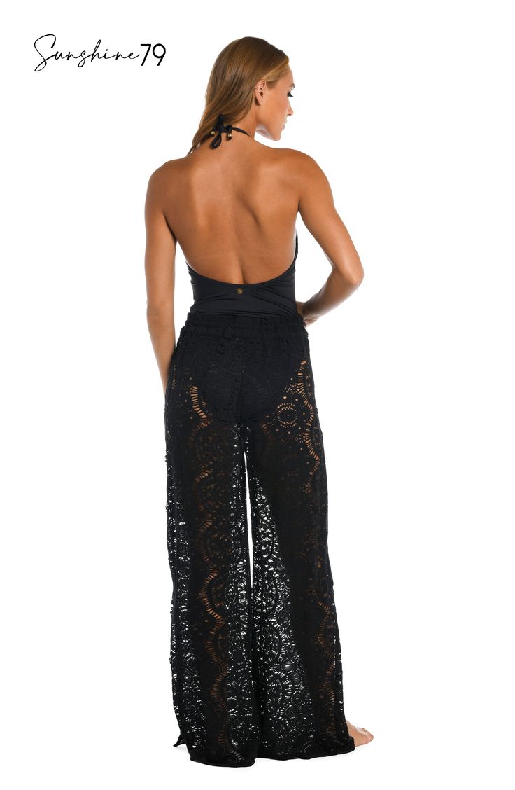 With a breezy boho vibe, these sophisticated palazzo pants from Sunshine 79 offer the crocheted look you've been searching for. Pull on over your favorite swimsuit for a chic cover-up or pair with a cami for an elevated look that's completely effortless. A waist tie finished with gold logo cord ends offers an adjustable fit. [split] Details Beach pants Adjustable waist tie Gold logo cord ends Wide, palazzo-style legs Fabric 100% Cotton Bohemian Tie-side Bottoms For Beach Party, Bohemian Stretch Bottoms For Beach, Full Length Pants For Beach Vacation, Black Summer Bottoms For Beach Cover-up, Fitted Beachy Bottoms For Beach Cover-up, Bohemian Tie-side Bottoms For Beach Cover-up, Bohemian Bottoms For Beach Party In Spring, Bohemian Maxi Bottoms For Beach Season, Bohemian Maxi Beach Bottoms