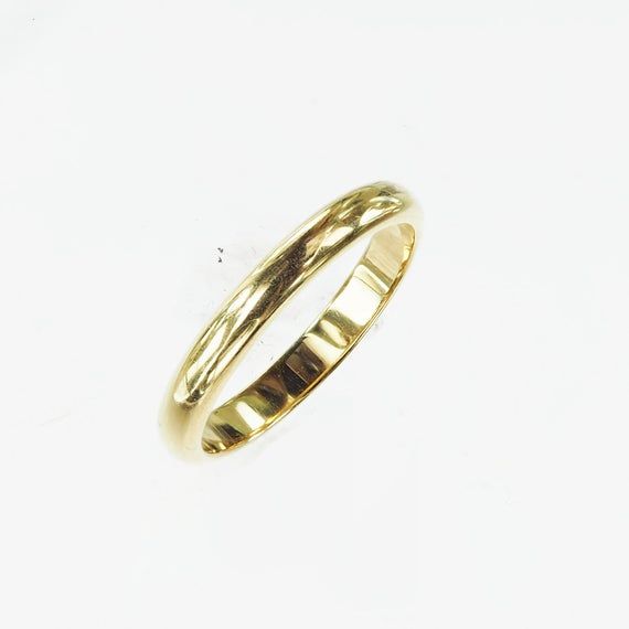 Vintage 1950's 14k yellow gold wedding band. The wedding band is a simple elegant gold wedding band. The band has the original "ArtCarved" trademark in script letters. This is a versatile and beautiful piece to add to a stackable ring set, by itself and as a wedding band. Other information: Size: 6Width: 1.8mm Height: 1.2mmSize: 7.5Width: 1.8mm Height: 1.2mm Classic Formal Engraved Ring With Polished Edges, Heirloom 14k Gold Wedding Band Thick Shape, Heirloom Yellow Gold Thick Band, Heirloom Thick Band In Yellow Gold, Classic Engraved Ring With Polished Edges, Classic Engraved Stackable Ring, Heirloom Engraved Stackable Ring For Formal Occasions, Classic Stackable Ring Bands, Yellow Gold Engraved Ring Stamped 14k For Marriage