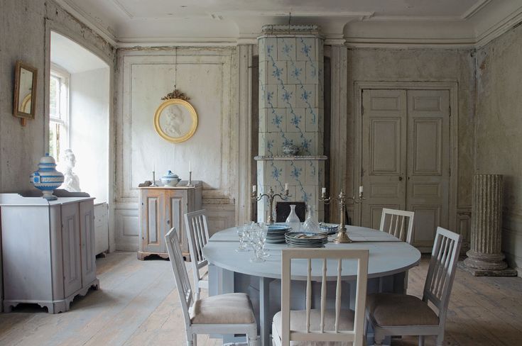 a dining room table with four chairs around it