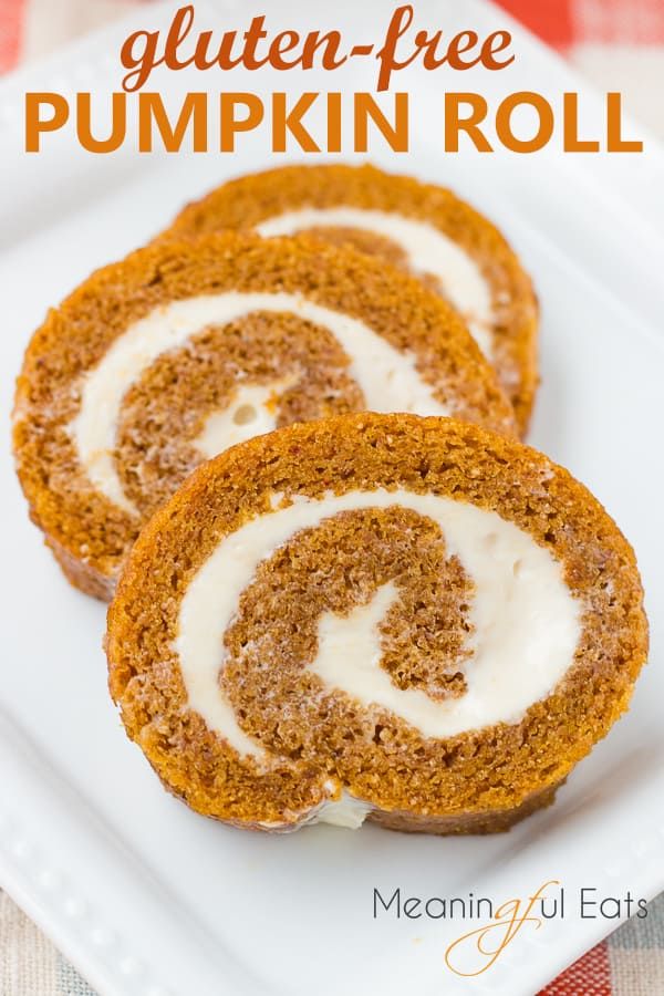 gluten - free pumpkin roll with cream cheese frosting on a white plate