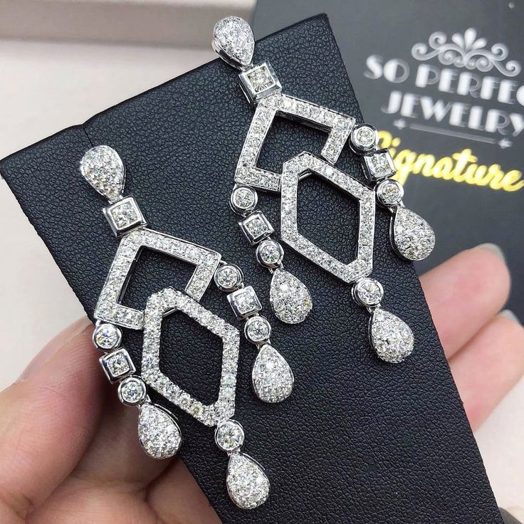 HANDCRAFTED TO PERFECTION! SPECIALLY DESIGNED! ABSOLUTELY Art Deco, GEOMETRIC, CHANDELIER EARRINGS. WITH OVER 178 PIECES OF PREMIUM GRADE, UNTREATED AND GENUINE F/VS QUALITY SPARKLING DIAMONDS! Perfect for every event! SET IN 18K SOLID WHITE GOLD HANDCRAFTED, CHANDELIER EARRINGS! THESE EARRINGS ARE SO BIG AND DAZZLING! EVERYBODY WON'T BE ABLE TO STOP LOOKING AT THEM! RETAIL VALUE: $8,600 DIAMONDS: 178 ROUND BRILLIANT, FULL CUT with excellent firing diamonds, weighting at 4.10 carats. ALL NATURAL Luxury Teardrop Bridal Earrings For Formal Occasions, Dazzling White Diamond-accent Chandelier Earrings, Luxury Drop Diamond Earrings With Elegant Design, Dazzling White Chandelier Earrings With Diamond Accents, Luxury Pear-shaped Bridal Earrings For Formal Occasions, Dazzling Diamond White Chandelier Earrings With Elegant Design, White Gold Cubic Zirconia Chandelier Earrings For Wedding, Luxury Diamond Cut Earrings For Wedding, Luxury White Gold Drop Diamond Earrings