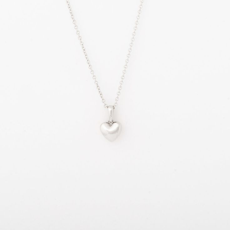 The Heart Necklace is the perfect piece for all of the loves in your life. Solid 14k gold heart pendant. Offered on an adjustable 16-18" chain or a 20" chain. Dimensions: 7mm Elegant Heart Pendant Necklace With Box Chain, Classic Heart-shaped Sterling Silver Necklace, Valentine's Day Necklace With Box Chain And Heart Pendant, Heart Pendant Necklace With Box Chain As Gift, Classic Round Pendant Necklace For Valentine's Day, Anniversary Heart Pendant Necklace With Box Chain, Valentine's Day Heart Pendant Necklace With Box Chain, Valentine's Day Heart Necklace With Box Chain, Classic Charm Necklace With Heart Pendant And Adjustable Chain